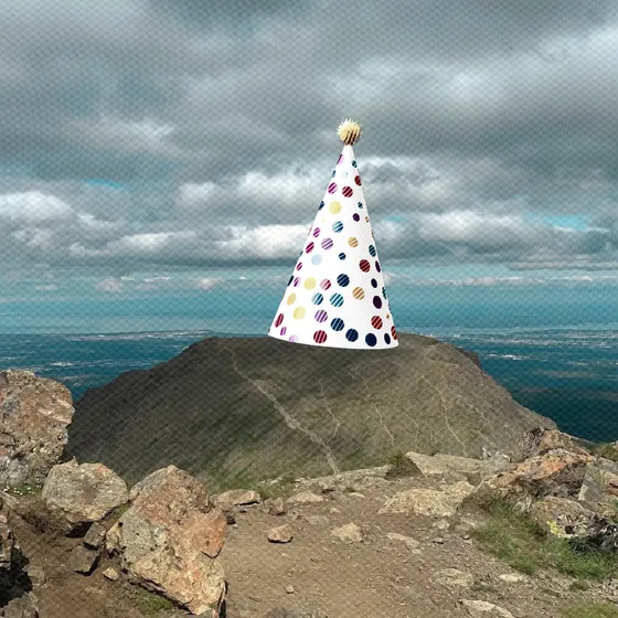 Flattop mountain wearing a party hat.