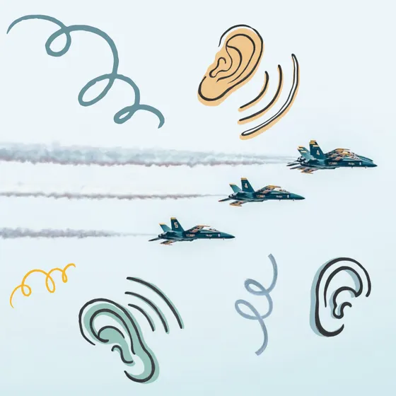 The Blue Angels flying amidst cartoon images of ears and swirls.